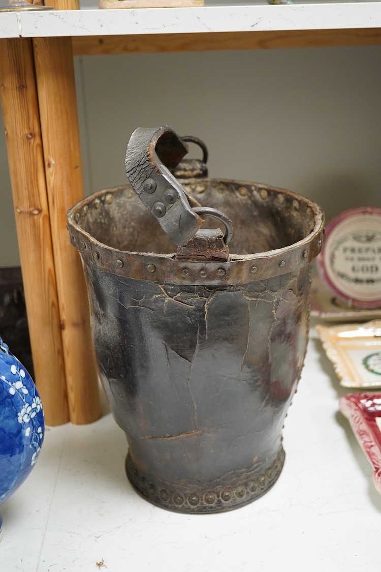 A 19th century leather fire bucket, 34cm high